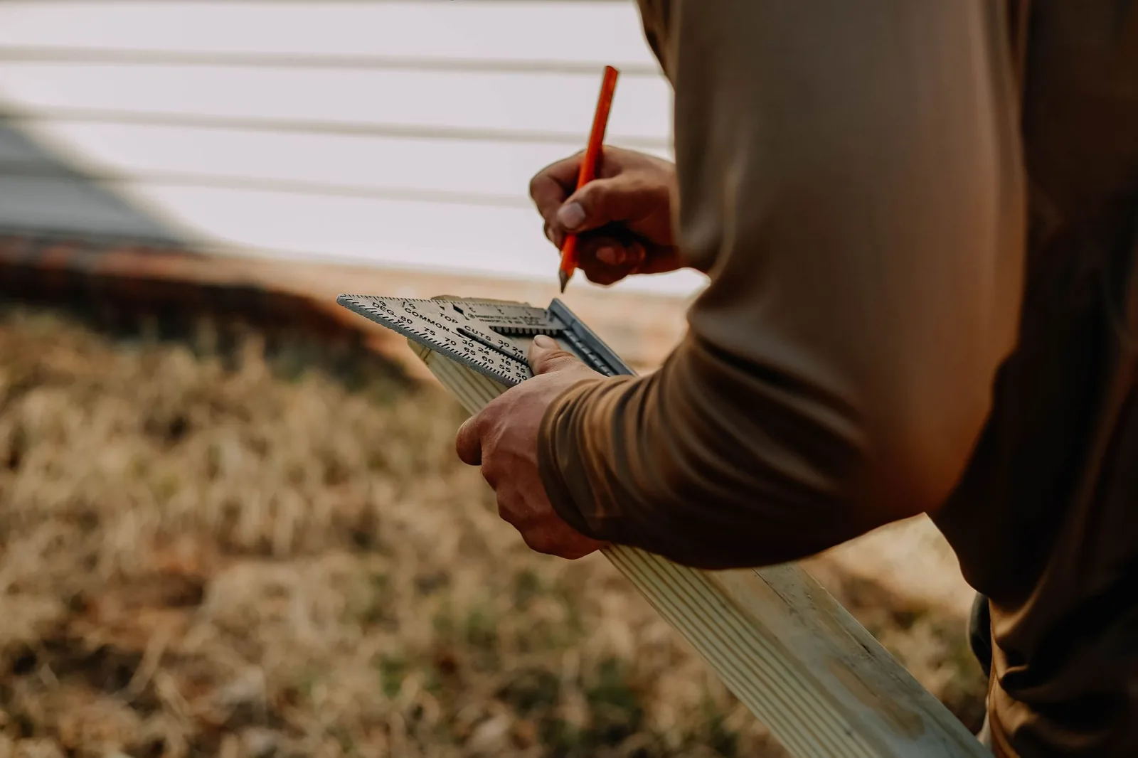A professional contractor installing new siding on the exterior of a home