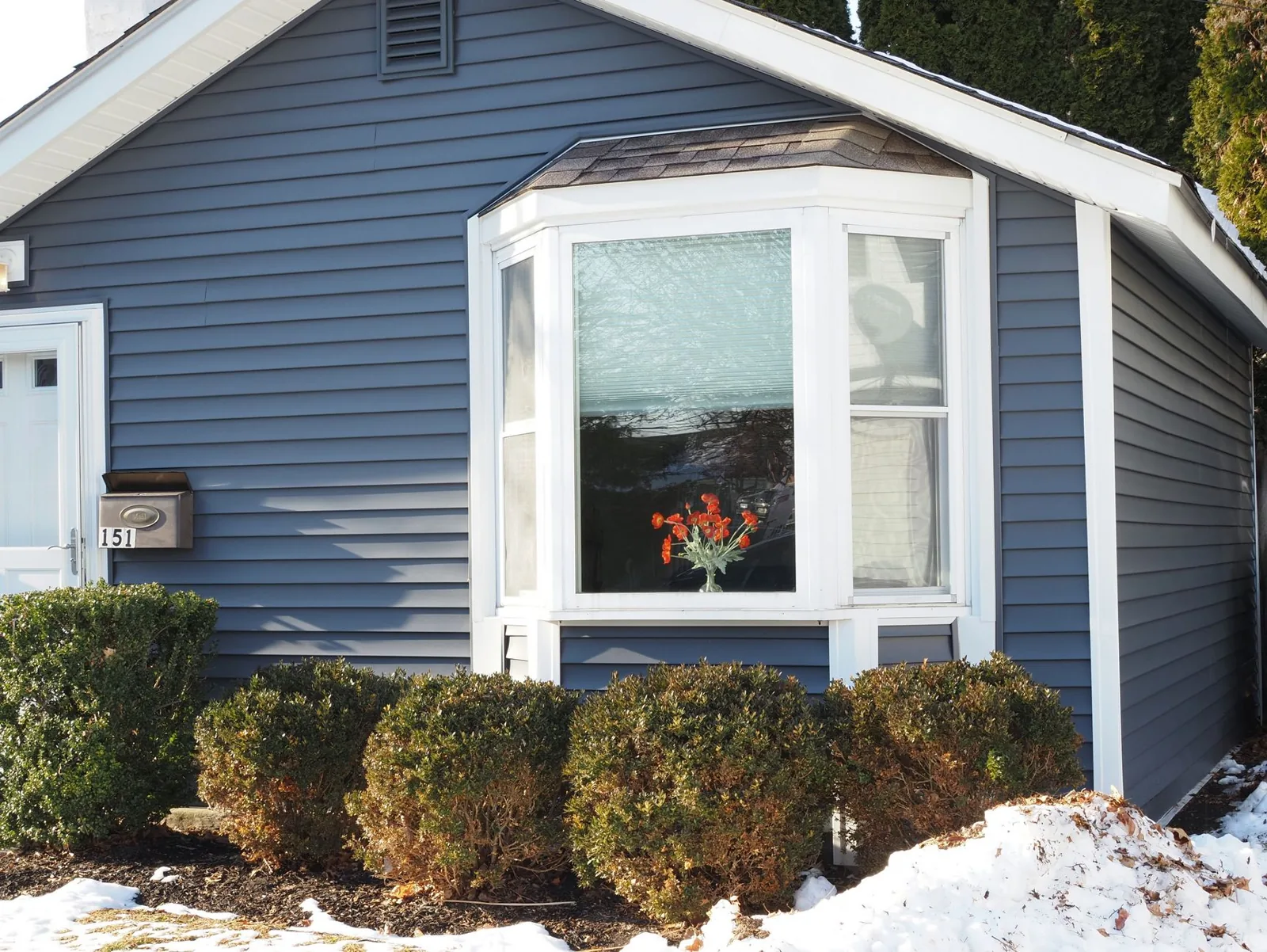 Newly installed siding on a suburban home